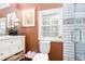 Well-lit bathroom with white subway tile shower and a classic vanity at 791 E Main Street, Canton, GA 30114