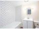 Clean bathroom with a tiled tub-shower combination and traditional vanity at 791 E Main Street, Canton, GA 30114
