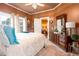 Inviting bedroom featuring a cozy bed with plush bedding, elegant dresser, and bright natural light at 791 E Main Street, Canton, GA 30114