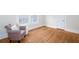 Bedroom with hardwood floors, a cozy chair, and natural light at 791 E Main Street, Canton, GA 30114