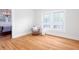 Bright bedroom with hardwood floors and a cozy chair at 791 E Main Street, Canton, GA 30114