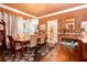 Formal dining room with wood floors, chandelier lighting, table for six, and tasteful decor at 791 E Main Street, Canton, GA 30114