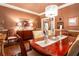Charming dining room featuring a chandelier, wooden table with seating for six, and detailed decor at 791 E Main Street, Canton, GA 30114