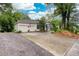 Charming home with a two-car garage, American flag, and well-maintained landscaping, showcasing curb appeal at 791 E Main Street, Canton, GA 30114