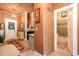 Hallway view of the home's interior with decorative rug and furnishings, leading to a view of a kitchen and bathroom at 791 E Main Street, Canton, GA 30114