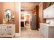 View of a small kitchen, adjacent to another area, featuring white countertops and a dining space at 791 E Main Street, Canton, GA 30114