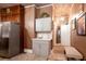 Kitchen with stainless steel refrigerator and cabinets, and a view into another room at 791 E Main Street, Canton, GA 30114