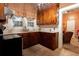 Kitchen area featuring white countertops, wooden cabinetry, a sink, and a view into the house at 791 E Main Street, Canton, GA 30114