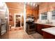 Kitchen featuring stainless steel appliances, wooden cabinetry, a sink, and view to another room at 791 E Main Street, Canton, GA 30114