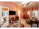 This living room has peach walls, neutral carpet, and bright light at 791 E Main Street, Canton, GA 30114