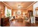 Inviting living room with dark hardwood floors, elegant decor, and a comfortable seating area at 791 E Main Street, Canton, GA 30114