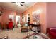 Living room features neutral carpet, a ceiling fan, and peach walls at 791 E Main Street, Canton, GA 30114