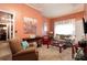 The living room features peach walls, neutral carpet, and an ornate accent chair at 791 E Main Street, Canton, GA 30114