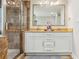 Elegant bathroom featuring double sink, granite countertop and walk-in shower with glass door at 119 Laurel Mill Ct, Roswell, GA 30076