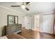 Bedroom featuring hardwood floors, large dresser and a walk-in closet at 119 Laurel Mill Ct, Roswell, GA 30076