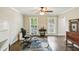Office space featuring hardwood floors, ceiling fan and windows providing natural light at 119 Laurel Mill Ct, Roswell, GA 30076