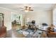 Home office with hardwood floors, ceiling fan and two windows providing natural light at 119 Laurel Mill Ct, Roswell, GA 30076