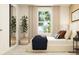 Well-lit bedroom with a modern bed, large windows, neutral color palette, and stylish decor at 2483 Cotton Ln, Douglasville, GA 30135