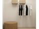 Organized walk-in closet with hanging rods and shelving for efficient storage solutions at 2483 Cotton Ln, Douglasville, GA 30135