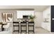 Bright kitchen featuring white cabinetry, granite countertops, stainless steel appliances, and eat-in island at 2483 Cotton Ln, Douglasville, GA 30135
