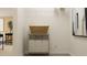 Functional laundry room with storage shelves, laundry hamper, and convenient organization solutions at 2483 Cotton Ln, Douglasville, GA 30135