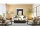 Inviting living room with modern seating, a sleek coffee table, and elegant artwork enhancing the ambiance at 2483 Cotton Ln, Douglasville, GA 30135