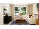 Comfortable living room with a plush sofa, stylish coffee table, and a media center with TV at 2483 Cotton Ln, Douglasville, GA 30135