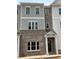 Newly constructed townhome featuring a brick facade and classic architectural design at 3336 Cranston Ln, Kennesaw, GA 30144