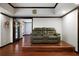 Finished basement area with dark wood trim and a comfortable seating arrangement at 685 Sienna Dr, Cumming, GA 30040