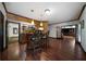Finished basement with a bar area, wooden floors, and neutral walls at 685 Sienna Dr, Cumming, GA 30040