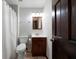 Bathroom featuring a vanity, toilet, and shower with curtain at 685 Sienna Dr, Cumming, GA 30040