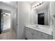 Bathroom featuring a white vanity with silver hardware and a large mirror at 685 Sienna Dr, Cumming, GA 30040