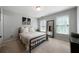 Bedroom with neutral paint, carpet, natural light, metal bed and accent furniture at 685 Sienna Dr, Cumming, GA 30040