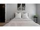Cozy bedroom featuring floral wall art, a black metal bed frame, and neutral décor at 685 Sienna Dr, Cumming, GA 30040