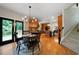 Open dining area with table, access to deck, and adjacent to the kitchen and stairs to the second floor at 685 Sienna Dr, Cumming, GA 30040