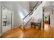 Bright foyer with hardwood floors, staircase with dark handrail, and an inviting ambiance at 685 Sienna Dr, Cumming, GA 30040