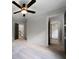 Hallway and staircase with neutral walls and carpets, and featuring black doors at 685 Sienna Dr, Cumming, GA 30040