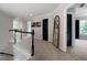 Hallway features neutral paint, carpet, railing and an oversized rustic framed mirror at 685 Sienna Dr, Cumming, GA 30040
