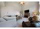 Spacious living room boasts high ceilings, comfortable seating, a stone fireplace, and plenty of natural light at 685 Sienna Dr, Cumming, GA 30040