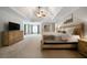 Spacious main bedroom with tray ceiling, neutral paint, ceiling fan and sitting area at 685 Sienna Dr, Cumming, GA 30040