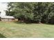 Large backyard with lush grass and detached garage at 8394 Banks Mill Rd, Douglasville, GA 30135