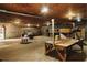 A roomy garage with concrete floors featuring work tables, an electric golf cart, and ample storage at 8394 Banks Mill Rd, Douglasville, GA 30135