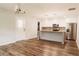 Modern kitchen with stainless steel appliances, island, and hardwood floors at 8394 Banks Mill Rd, Douglasville, GA 30135