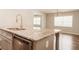 Close-up of kitchen island featuring stainless steel dishwasher and granite countertops at 8394 Banks Mill Rd, Douglasville, GA 30135