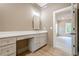 A bathroom features a vanity with a white countertop and drawers with gold knobs at 912 Oak Dr, Woodstock, GA 30189