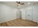 Spacious bedroom with a ceiling fan, double doors and a door that goes into another room at 912 Oak Dr, Woodstock, GA 30189