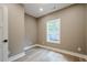 Cozy bedroom featuring wood-look flooring and a bright window with natural light at 912 Oak Dr, Woodstock, GA 30189