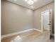 Clean, bright bedroom featuring wood-look flooring and neutral paint at 912 Oak Dr, Woodstock, GA 30189