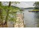 Beautiful waterfront property featuring a private dock with boat slip, offering stunning lake access at 912 Oak Dr, Woodstock, GA 30189