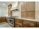 A kitchen features wood cabinets, white countertops, and a stainless steel range at 912 Oak Dr, Woodstock, GA 30189